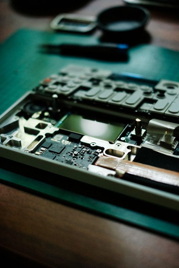 Close-up view of a laptops internal motherboard components for repair or upgrade.